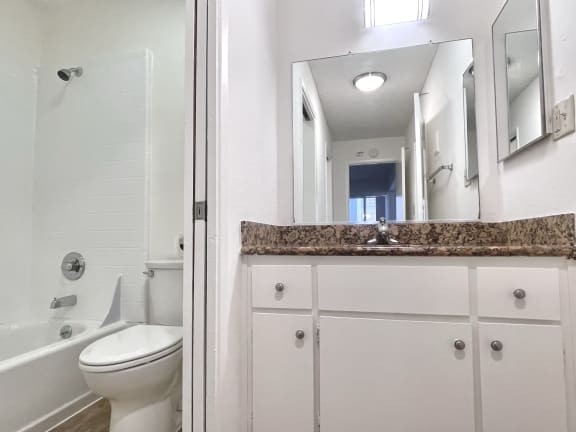 a bathroom with a toilet sink and bathtub