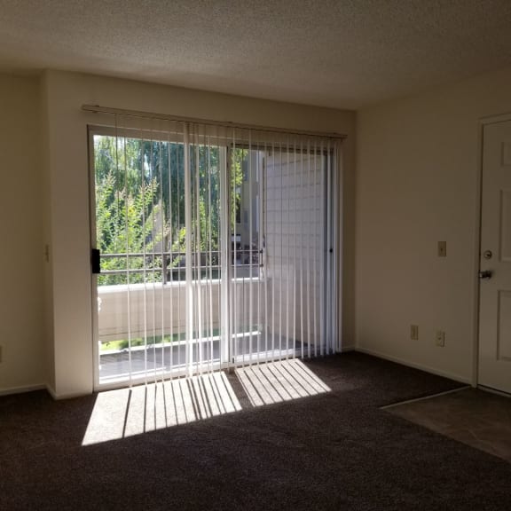 Tassajara 2x2.25 living room featuring patio access  (basic)