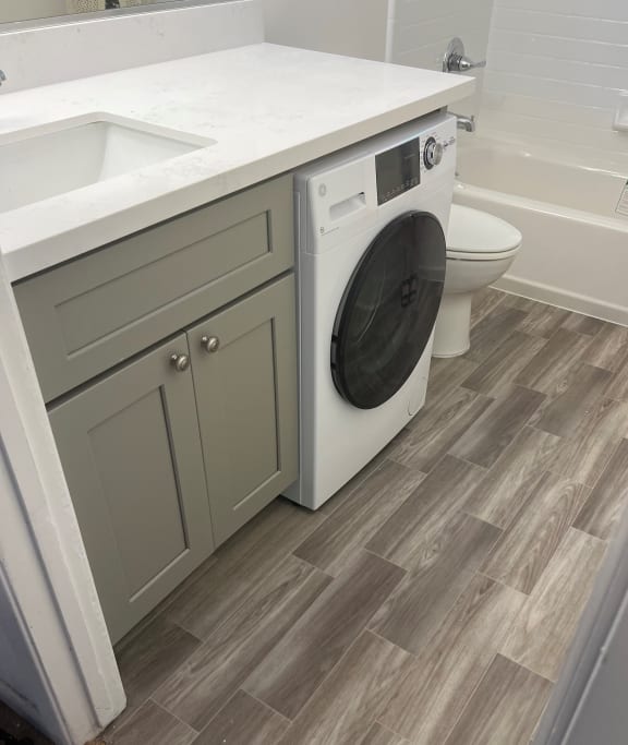a washer and dryer in a bathroom
