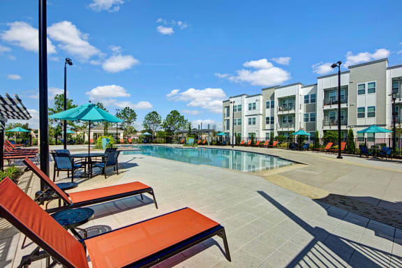 beautiful swimming pool with deck chairs at Linden on the GreeneWay, Florida, 32824