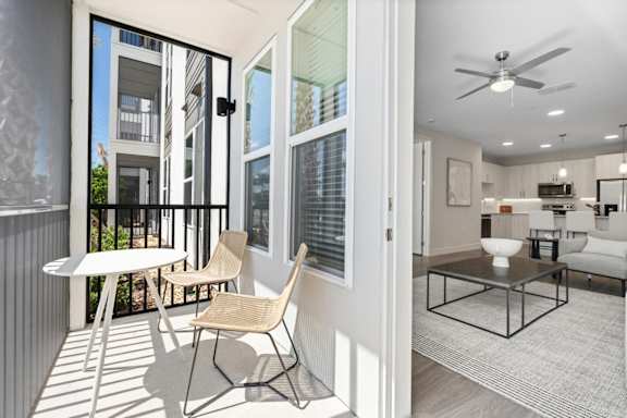Apartment balcony with table and chairs