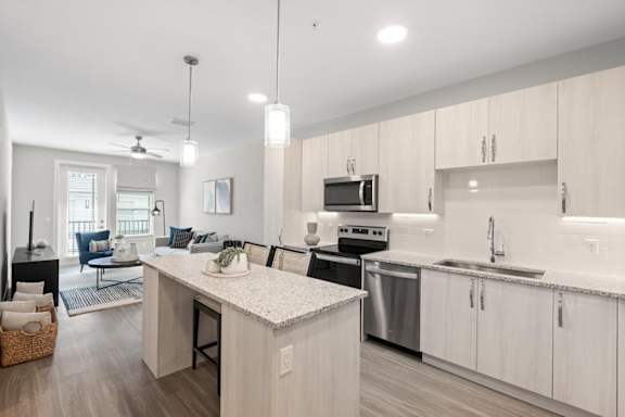 A modern kitchen with island  and enhanced cabinetry