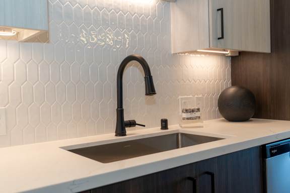 A modern kitchen with executive chef-style undermount sink