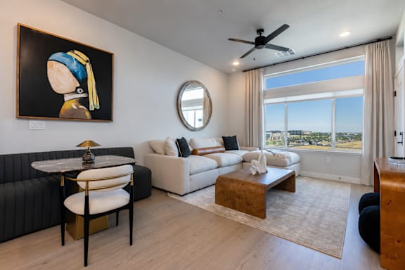 A spacious living room with large expansive windows