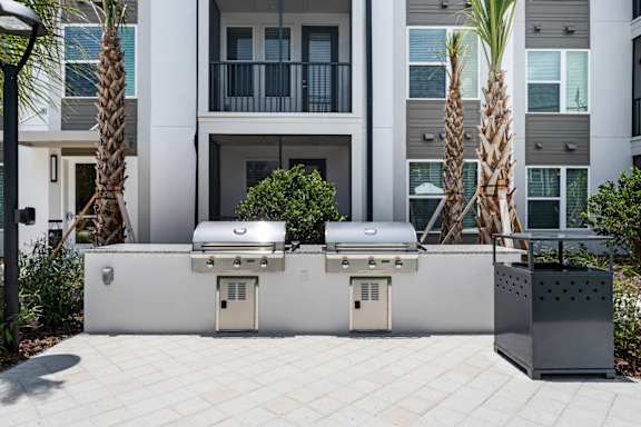 two outdoor grills in courtyard at Mira at Palmer Ranch in Sarasota, FL