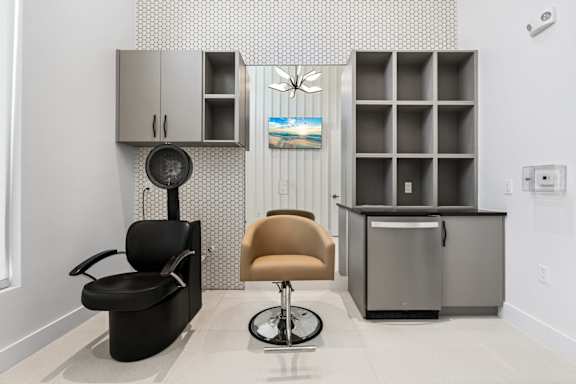 a salon room with a chair and a counter at Mira at Palmer Ranch in Sarasota, FL