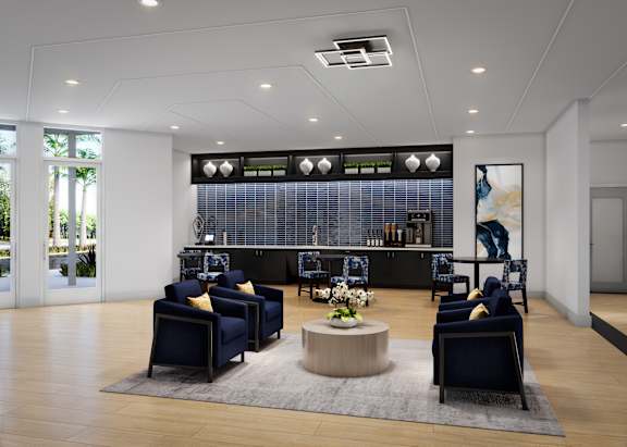 A modern waiting room with blue chairs and a wooden coffee table.