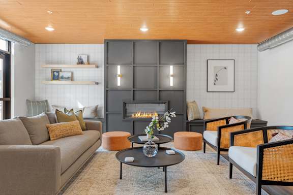 A living room with a fireplace and a couch.