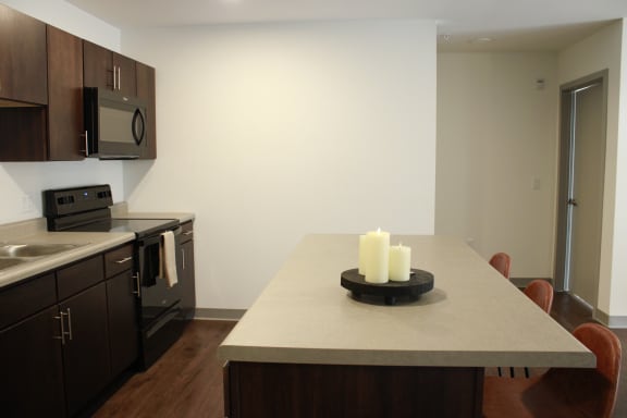 a kitchen and dining area in a 555 waverly unit