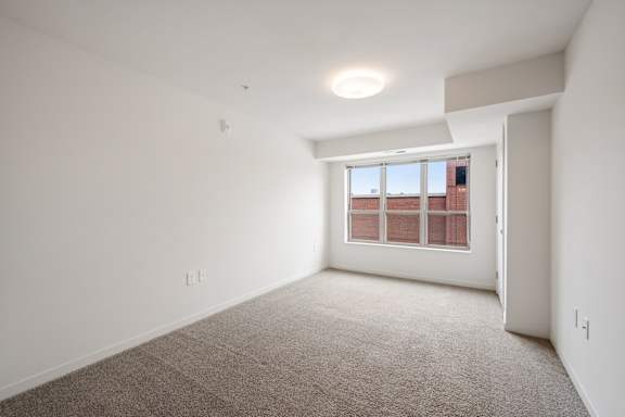 Bedroom with Plush Carpeting at Alo Apartments in Buffalo MN