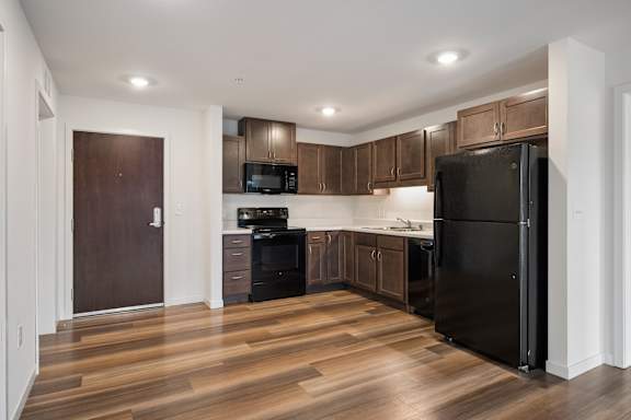 Kitchen with Black Appliances at Alo Apartments in Buffalo MN