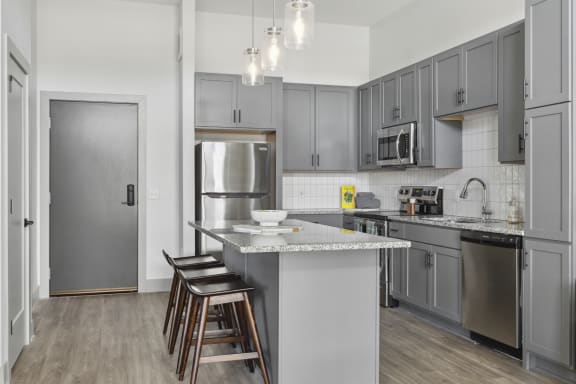 Savor apartments 1 bedroom kitchen with grey cabinets