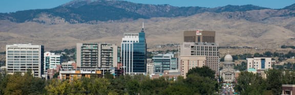 the city with the mountains in the background