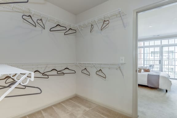 an image of a closet with hooks on the wall and a bed in the corner at Garfield Park, Virginia