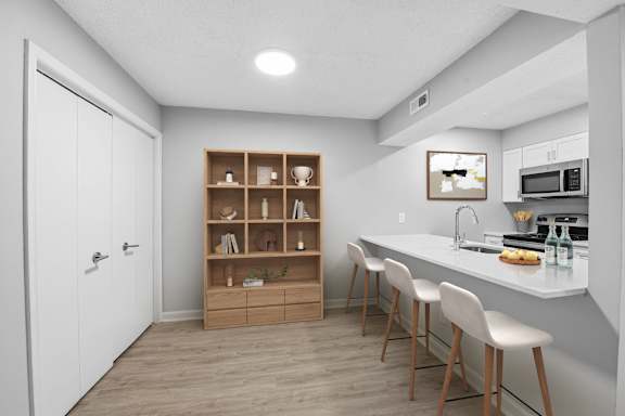 A kitchen with a white countertop and a white door at Brampton Moors, Cary, NC