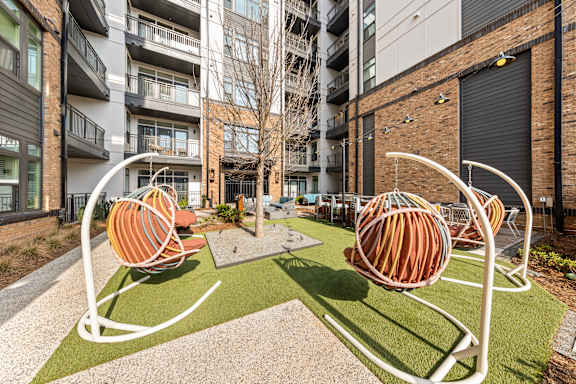 Outdoor Hanging Chairs at Hawkins Press Apartments, Charlotte, NC, 28203