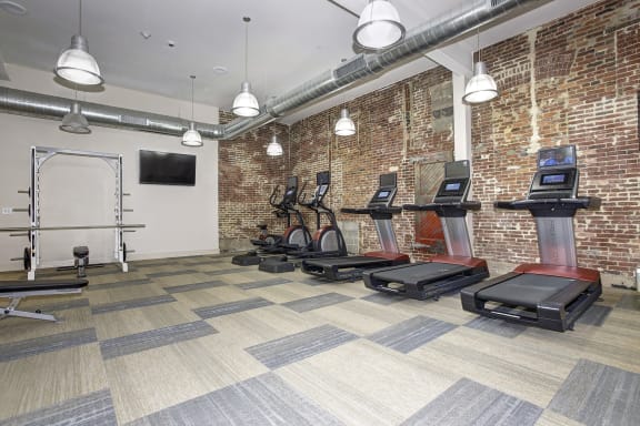 the gym at the district flats apartments in lenexa at The Gunther, Maryland, 21224