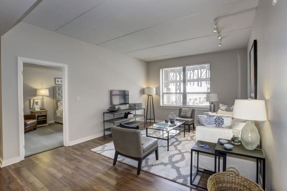 an open living room with a couch and a table at The Gunther, Baltimore, Maryland