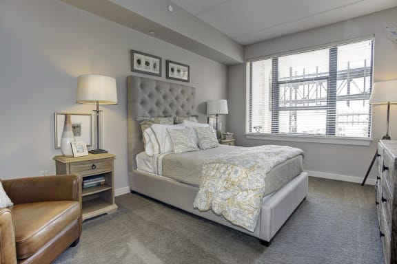 a bedroom with a bed and a window at The Gunther, Baltimore, Maryland