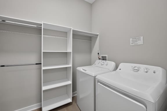 A white bathroom with a tub and sink.