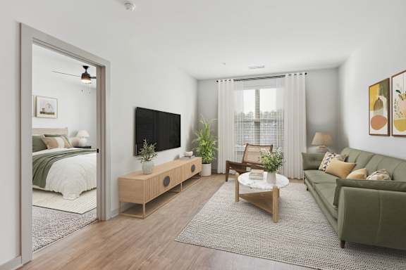 A modern living room with a green couch and a wooden coffee table.