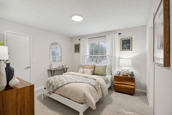 a bedroom with a bed and a window at St. Andrews Reserve, North Carolina, 28412