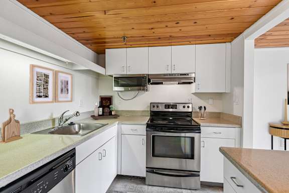 a kitchen with stainless steel appliances at Tindeco Wharf, Maryland