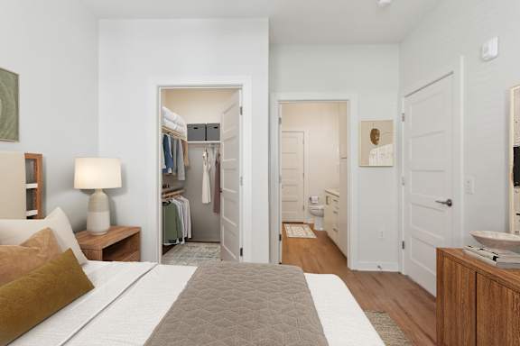 A bedroom with a bed, nightstand, and closet at Hawkins Press, Charlotte, North Carolina