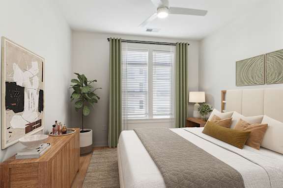 A bedroom with a large bed and a painting on the wall at Hawkins Press, Charlotte, North Carolina