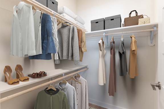 A closet with clothes and shoes hanging on shelves at Hawkins Press, Charlotte, North Carolina