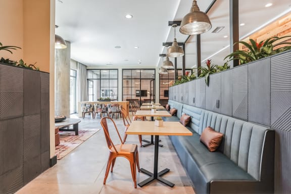 a seating area with tables and couches in a restaurant at Hawkins Press, North Carolina