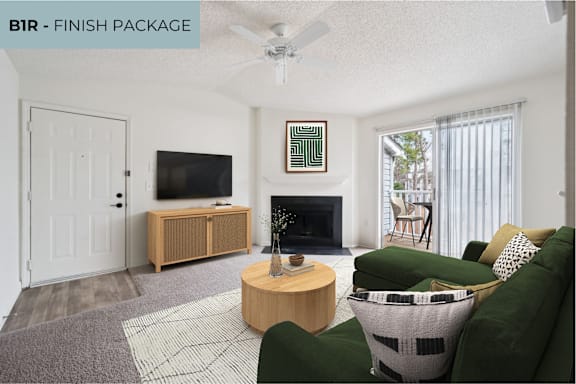 A living room with a green couch and a wooden coffee table.