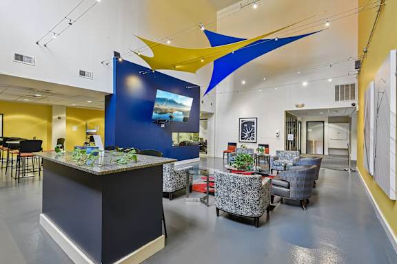 A sititng area with a blue counter and chairs at Tindeco, Wharf, Baltimore, MD 21224