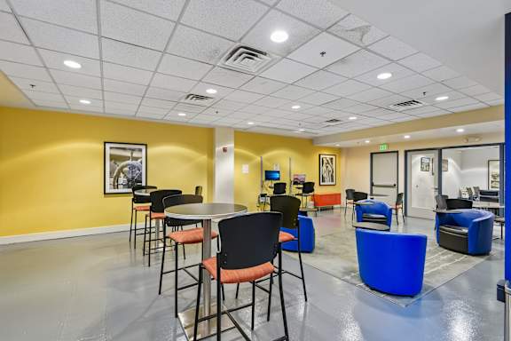 a room with tables and chairs and a computer in a room at Tindeco Wharf, Baltimore Maryland