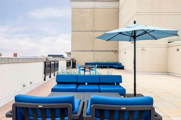 A blue umbrella is on a blue chair. at Loree Grand at Union Place, Washington, Washington