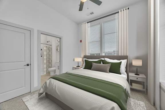 A bedroom with a large bed and a ceiling fan
