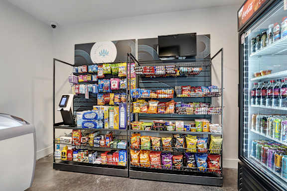 A refrigerated display case filled with snacks and drinks.