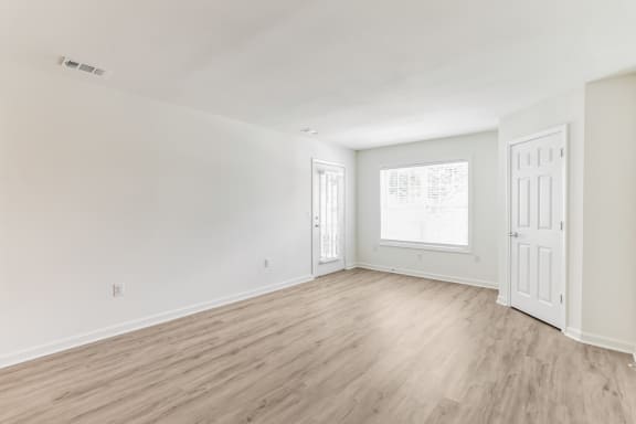 a bedroom with hardwood floors and white wallsat St. Andrews Reserve, Wilmington, 28412