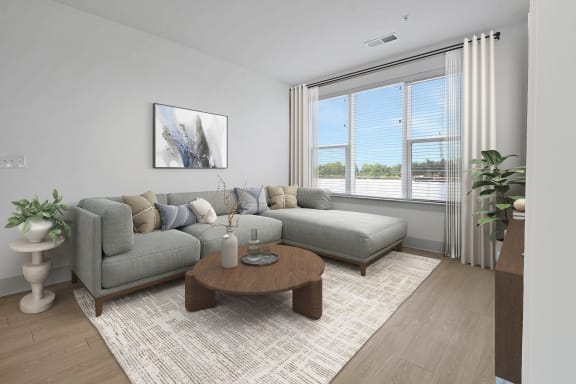 a living room with a couch and a coffee table at Metropolitan at the Riverwalk, Wilmington, NC