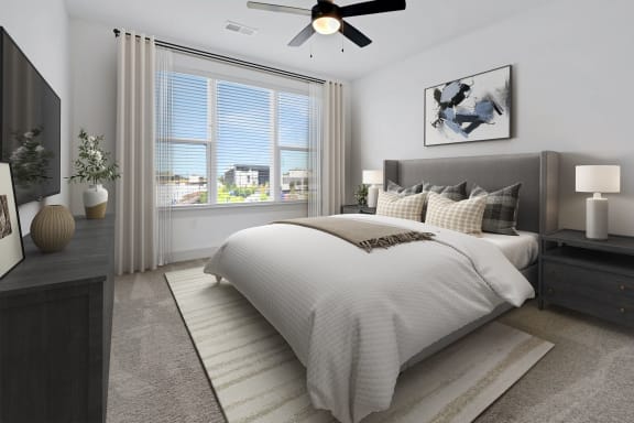 a bedroom with a large bed and a window at Metropolitan at the Riverwalk, Wilmington, NC