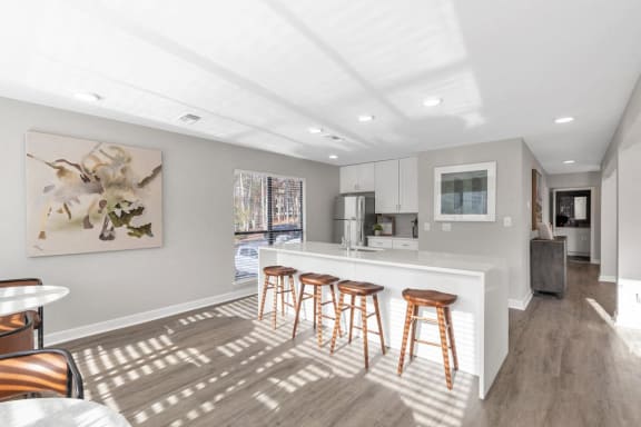 a kitchen with a bar and stools at Brampton Moors, North Carolina, 27513