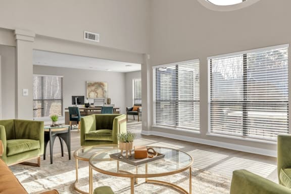 a living room with large windows and a glass coffee table  at Brampton Moors, North Carolina, 27513
