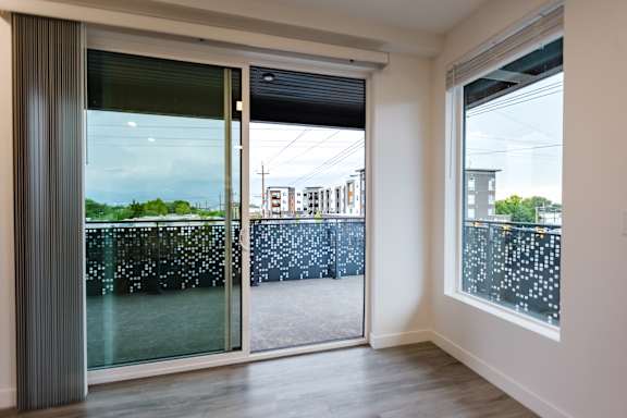 A room with a view of a water body through the window.