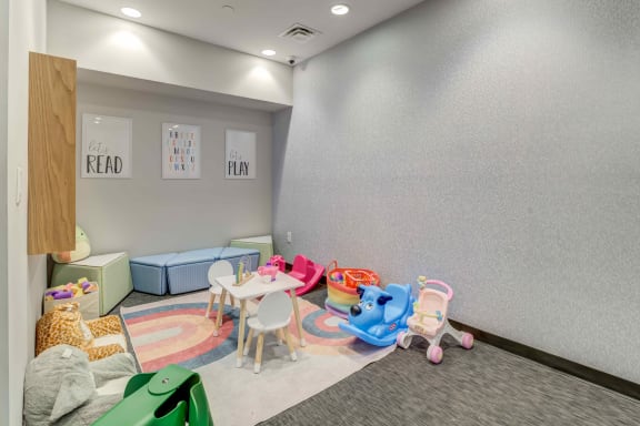 a room with a bunch of toys on the floor at Delamarre at Celebration, Celebration, FL 34747
