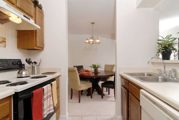 a kitchen and dining area in a 555 waverly unit at Brampton Moors, Cary, North Carolina