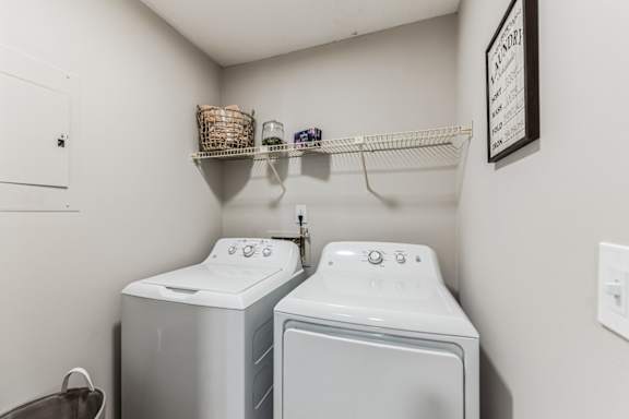 A laundry room with a washer and dryer.