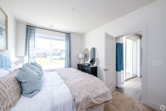 a bedroom with a large bed and a window at Fairmont at South Lake, Bowie, 20716