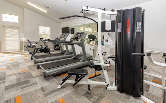 A gym with treadmills and exercise equipment.at Sunset Ridge, West Jordan, UT 84081