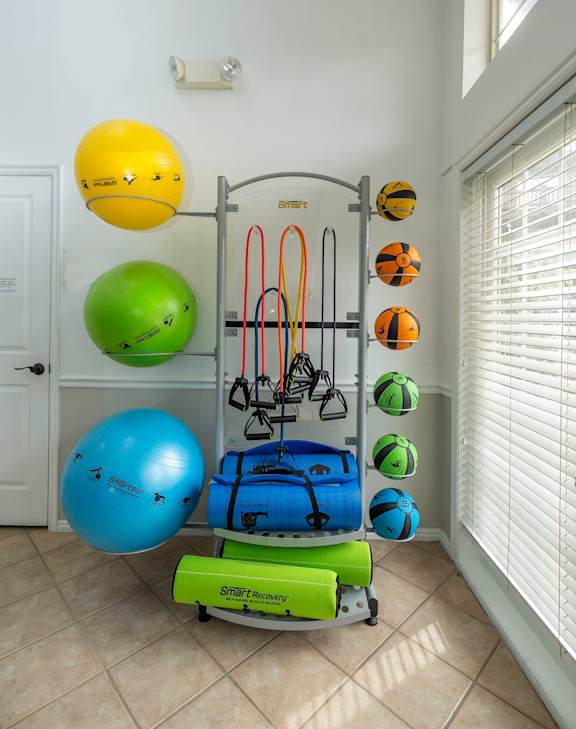 A gym equipment set up in a room.at Sunset Ridge, West Jordan, UT