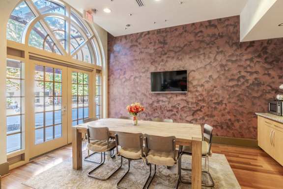 A dining room with a table set for four